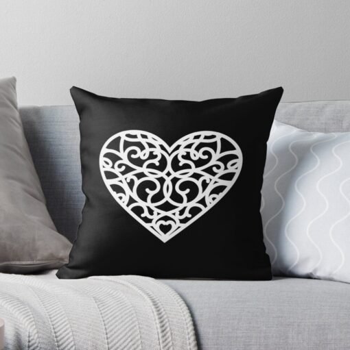 Black throw pillow with heart designs